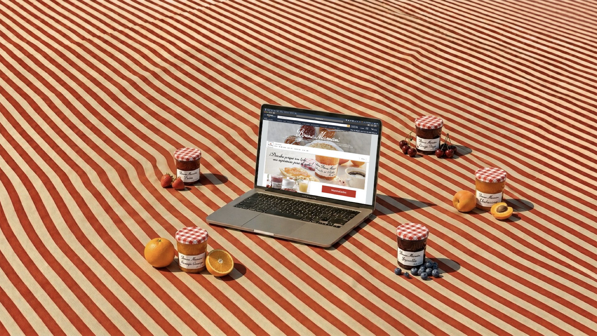 Bonne Maman Amazon storefront on a laptop screen, with five hand-illustrated jam jars staged in front — Naranja Amarga, Fresa, Cereza Roja, Chabacano, and Grosella, each beside its own fruit