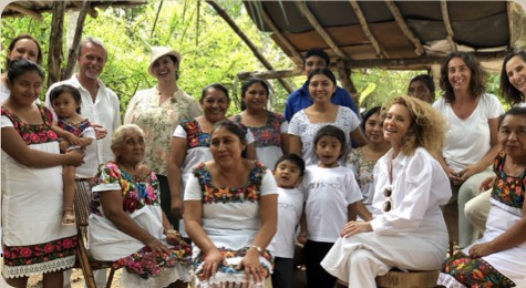 Group portrait with the Mayan artisan community at the Bee School site