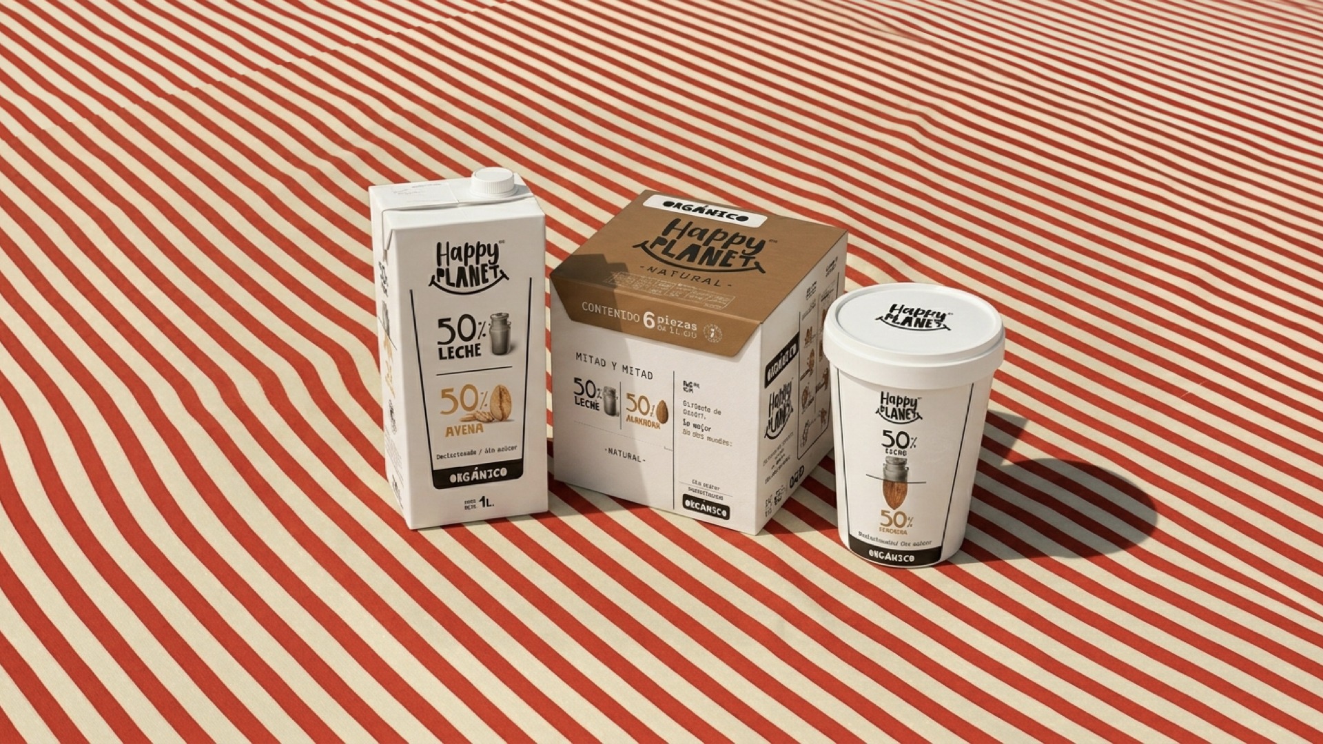Happy Planet mitad y mitad packaging range — oat-milk carton two-pack, six-piece variety box, and almond-milk cup