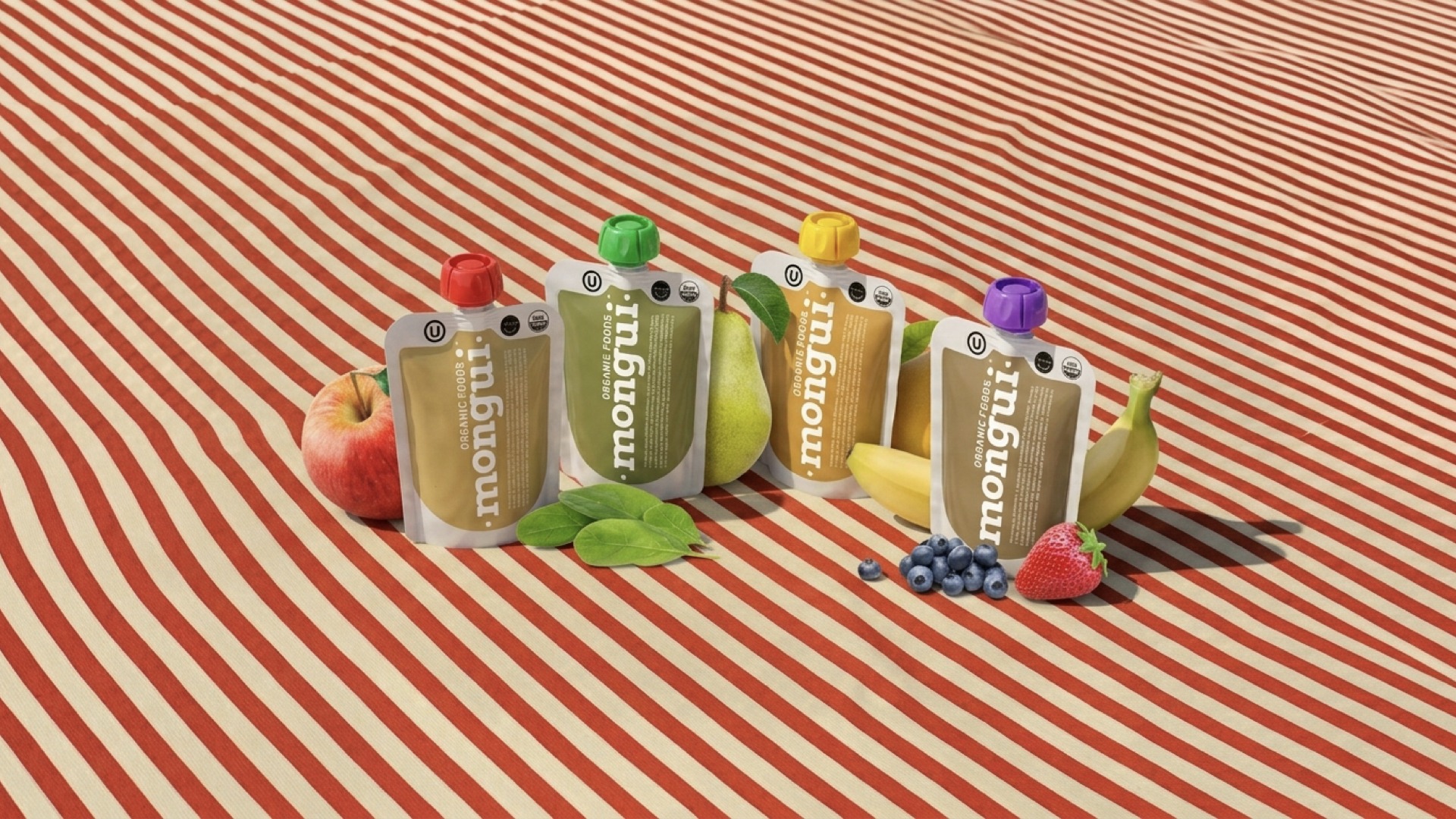 Four Mongui organic fruit pouches — apple, pear, banana, and berry flavors — staged with real fruit